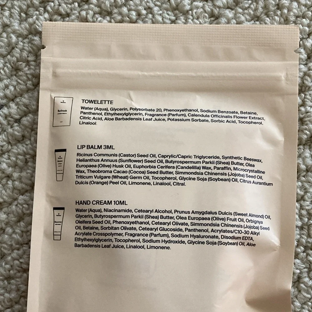 Therabody Arrive Revived Wellness Pack Towelette Lip Balm Hair Cream